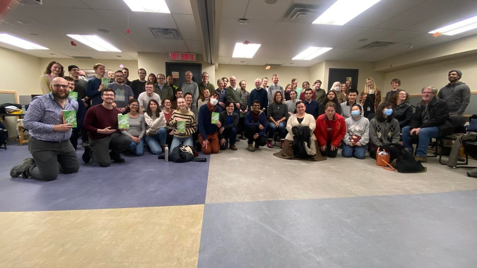 Picture shows a group of about 60 people at a meeting to discuss the book Streetfight on urbanism in New York. 